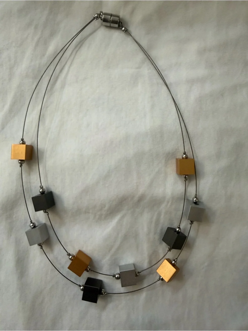 Modern Geometric Cube Necklace in Gold, Silver, and Black